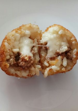 A picture of Arancini - mozzarella and ragù stuffed rice balls.