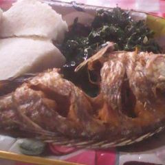 A picture of Fish stew with ugali.