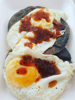 A picture of Huevos Rancheros with Blue Corn Tortillas.
