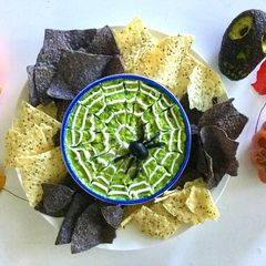 A picture of Halloween spider web guacamole.