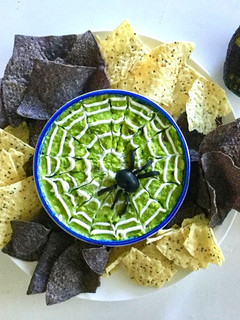 A picture of Halloween spider web guacamole.