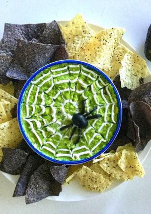 A picture of Halloween spider web guacamole.