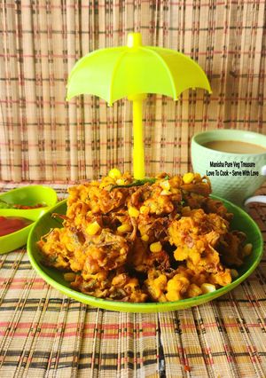 A picture of Crispy Corn, Bell Pepper, and Onion Fritters – Corn Capsicum Onion Fritters – Monsoon Munching – Ready in 15 Minutes.