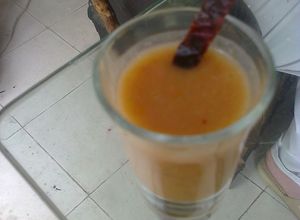 Una foto de Chupito salado de mango y chile guajillo asado Martín