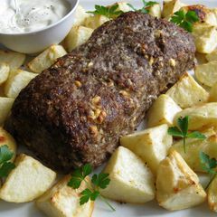 A picture of Lamb Meatloaf with Roast Potatoes.