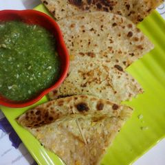 Chole rice paratha with small kachri & mix coriander chutney (without onion) A picture of Chole rice paratha with small kachri & mix coriander chutney (without onion).