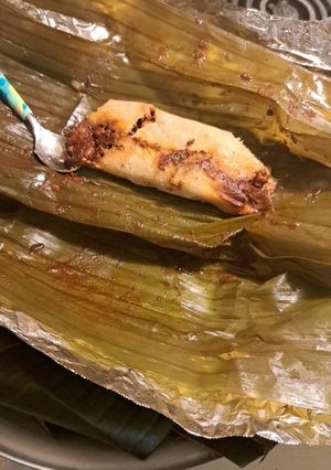 Una foto de Tamales de cerdo en adobo rojo