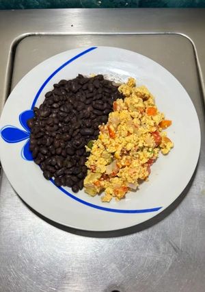 A picture of Mexican Sunrise: Eggs with Serrano Pepper, Red Onion, and Tomato.