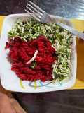 Beetroot pasta topped with scrambled paneer