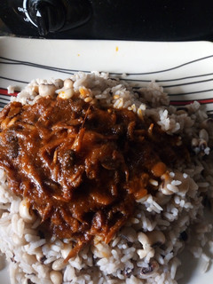 A picture of Rice and beans withCrayfish iru stew.