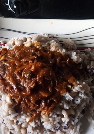 A picture of Rice and beans withCrayfish iru stew.