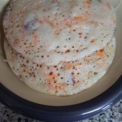 A picture of Carrot sinasir(rice and carrot pancake).