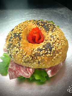 A picture of Delicious salami bagel.