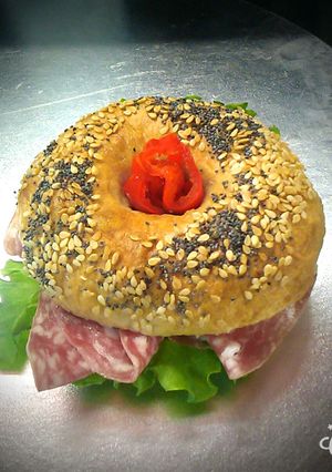A picture of Delicious salami bagel.