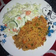 A picture of Fried rice with salad.