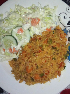 A picture of Fried rice with salad.