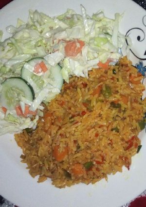 A picture of Fried rice with salad.