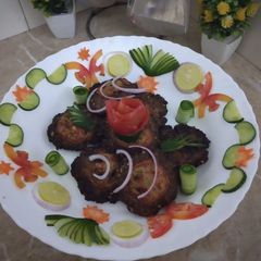 A picture of Chapli kabab in fry pan.