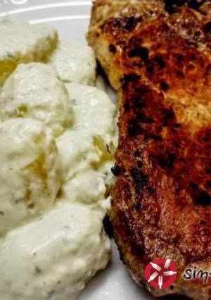 A picture of Pork Chop with Potato Gnocchi and Blue Cheese.