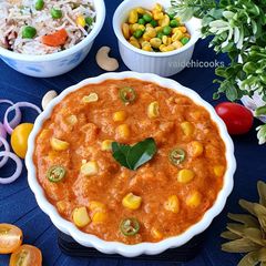 A picture of Tomato corn Bharta or curry.