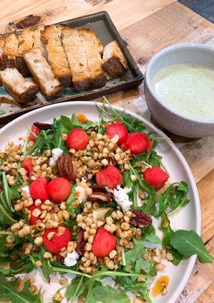 A picture of Arugula and watermelon salad.