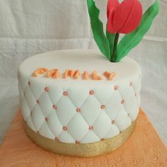 A picture of Chocolate with ground nuts cake covered in fondant.