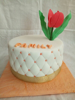 A picture of Chocolate with ground nuts cake covered in fondant.