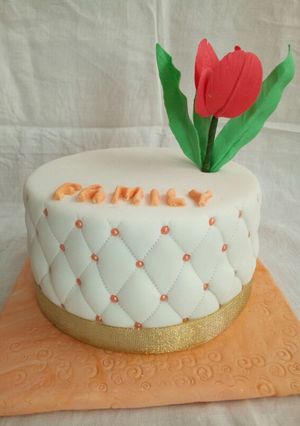 A picture of Chocolate with ground nuts cake covered in fondant.