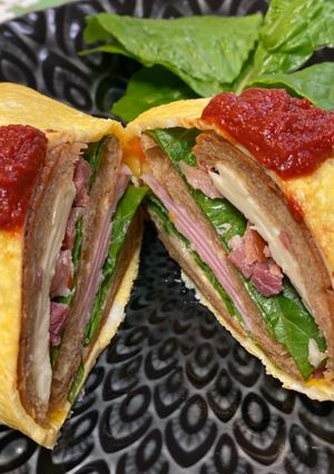 A picture of Omu Sandwich (Sandwich wrapped with egg fry).
