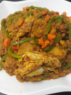 A picture of Porriage beans with ripe plantain and titus fish.