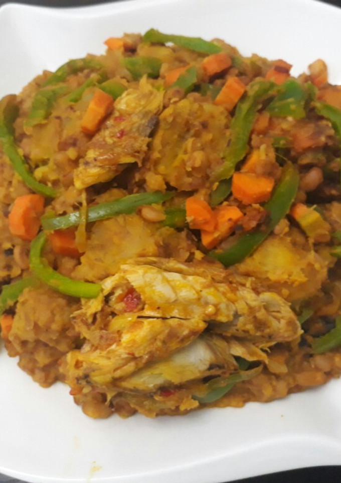 A picture of Porriage beans with ripe plantain and titus fish.