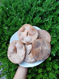 Una foto de Tortas fritas dulces de harina integral y naranja