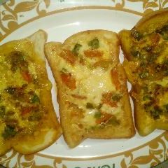 A picture of Fried bread with vegetables.