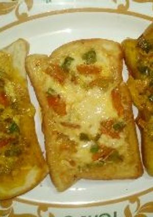 A picture of Fried bread with vegetables.
