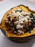 Roasted Acorn Squash with Sausage, Farro, Spinach, and Feta