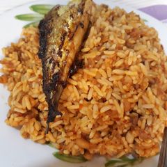 A picture of Rice and beans with titus fish.
