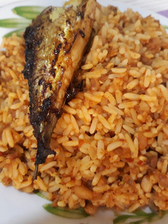A picture of Rice and beans with titus fish.