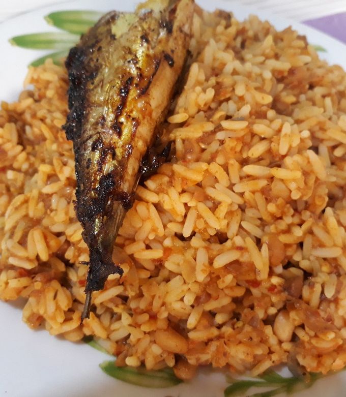 A picture of Rice and beans with titus fish.