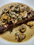 Steak with tarragon mushroom sauce