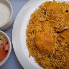 A picture of Chicken biryani with potatoes.