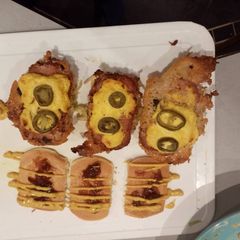 A picture of Cheesy Spam fritter pancake sandwich.