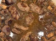 A picture of round steak and mushrooms