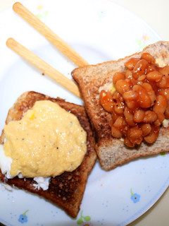 A picture of Toast with Eggs Benedict and Baked Beans.