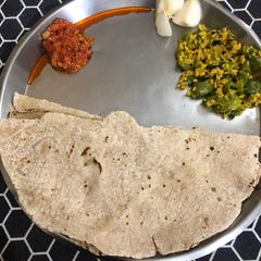 A picture of Jowar Bhakari with vegetable.
