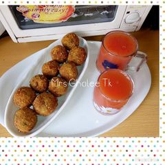 A picture of Yam balls with orange and watermelon drink.