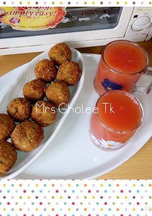 A picture of Yam balls with orange and watermelon drink.