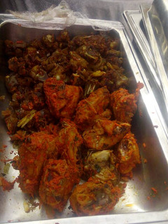 A picture of Chicken periperi and sauced goat meat.