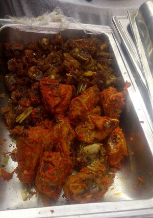 A picture of Chicken periperi and sauced goat meat.