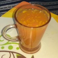 A picture of Orange carrot juice with haldi, ginger.