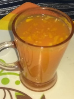 A picture of Orange carrot juice with haldi, ginger.